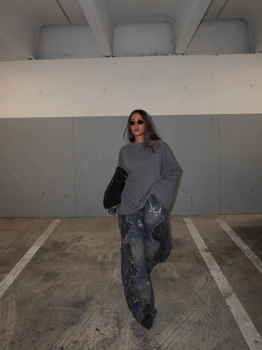 JEANS BAGGY CON TOPPE E GIOIELLO