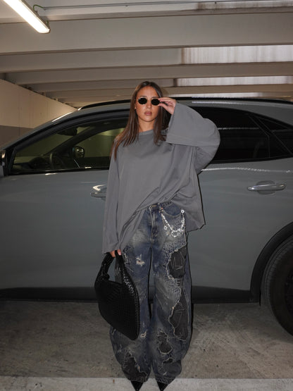 JEANS BAGGY CON TOPPE E GIOIELLO