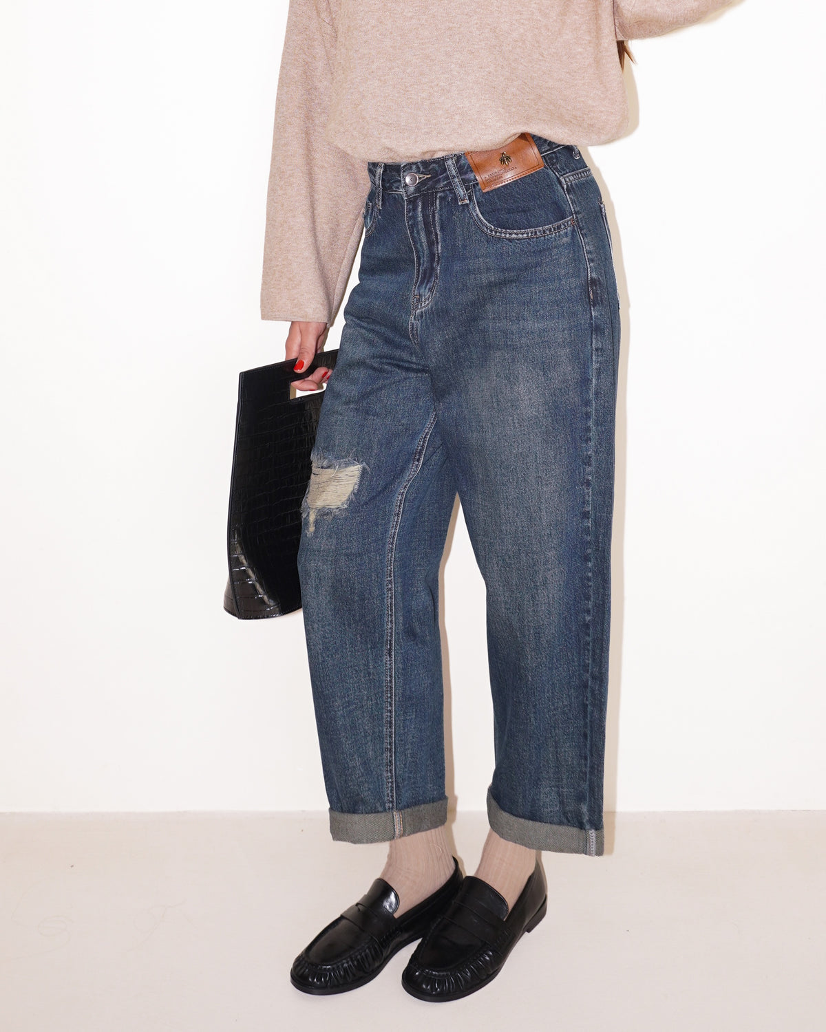 JEANS EFFETTO ROVINATO CON RISVOLTI