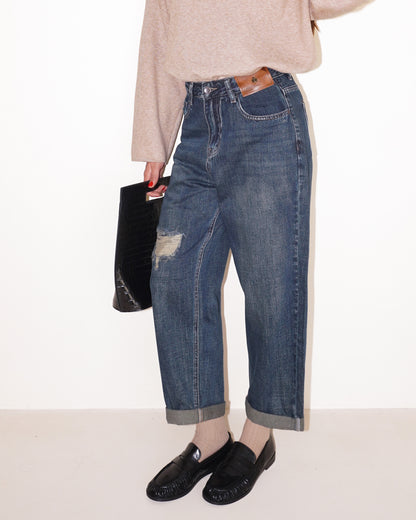 JEANS EFFETTO ROVINATO CON RISVOLTI